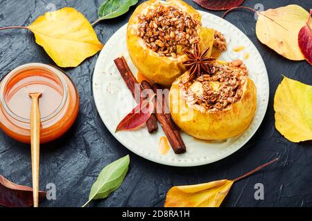 Baked apples stuffed with granola and nuts.Baking concept Stock Photo
