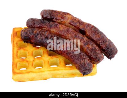 Grilled pork sausages on a potato waffle isolated on a white background Stock Photo