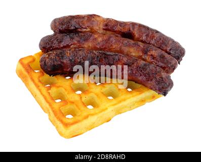 Grilled pork sausages on a potato waffle isolated on a white background Stock Photo