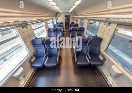 View of the interior of a train with empty seats Stock Photo