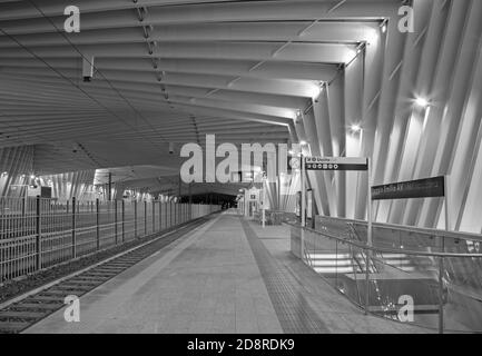 REGGIO EMILIA, ITALY - APRIL 13, 2018:  The Reggio Emilia AV Mediopadana railway station at dusk by architect Santiago Calatrava. Stock Photo