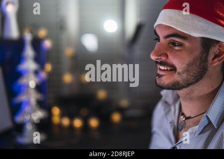 Closeup shot of a man wearing a Santa hat Stock Photo