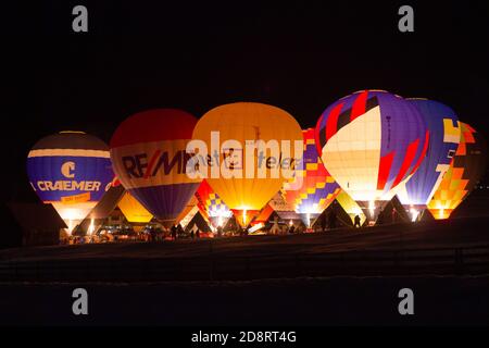 Filzmoos, Salzburg county/Austria - 01 12 2014: Several hot air balloons illuminated at night during the 'Nacht der Ballone' festival Stock Photo
