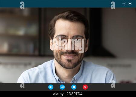 Head shot portrait screen view man wearing glasses using app Stock Photo