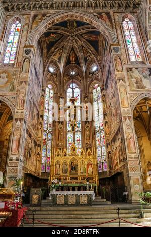 Great view of the impressive main chapel with the crucifix hanging over the high altar in the Basilica of Santa Croce in Florence, Tuscany, Italy. Stock Photo