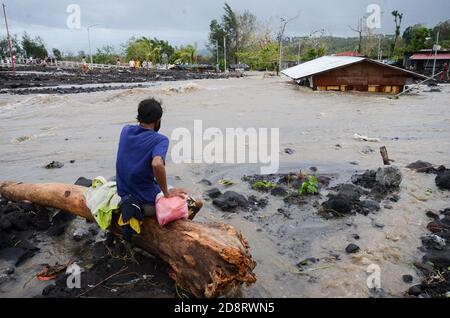 Albay Province, Philippines. 1st Nov, 2020. A man looks at a house submerged in floodwaters brought by the heavy rains from typhoon Goni in Albay Province, the Philippines, Nov. 1, 2020. Super Typhoon Goni barrelled into the southern part of the Philippines' main Luzon island with 'catastrophic violent winds and intense torrential rains' on Sunday, triggering flash floods and mudslides that killed at least four people. Credit: Str/Xinhua/Alamy Live News Stock Photo