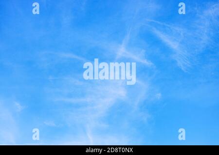 blurred cirrus clouds in blue sky on autumn day Stock Photo
