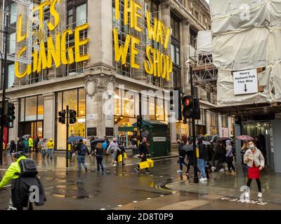 Shoppers in the rain o Oxford Street the weekend before a second national lockdown in England because of coronavirus. Stock Photo