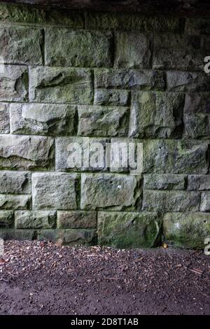 Heavy duty stone built bridge wall Stock Photo