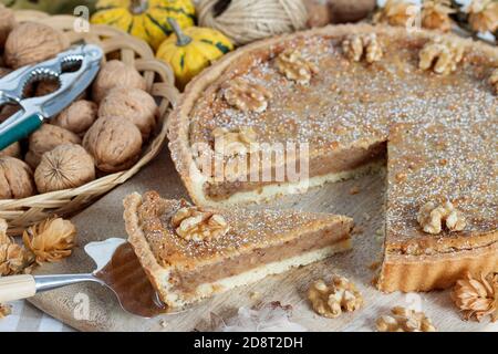 walnut tart and fresh walnuts in basket Stock Photo