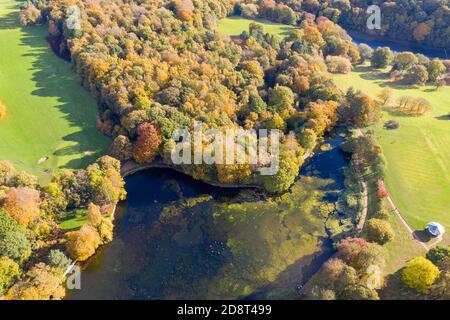 A beautiful aerial photo in the autumn fall at the park in Leeds West Yorkshire known as Roundhay Park showing the brown and green colours on the tree Stock Photo