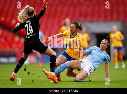 Everton's Hayley Raso (centre) battles for the ball with Manchester City's Lucy Bronze (right) and goalkeeper Ellie Roebuck during the Women's FA Cup Final at Wembley Stadium, London. Stock Photo