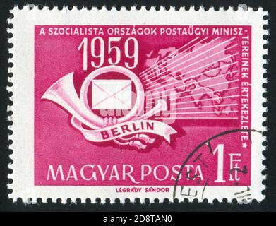 HUNGARY – CIRCA 1959: stamp printed by Hungary, shows horn, letter and Worldmap, circa 1959 Stock Photo