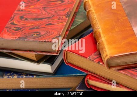 Two stacks of old books with ancient bindings Stock Photo