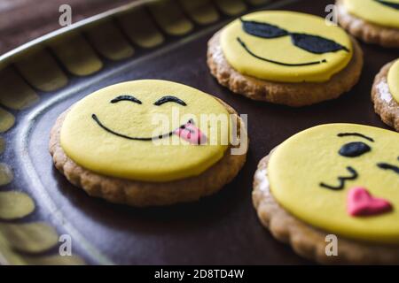 Closeup of cookies with decorated funny smiley faces Stock Photo