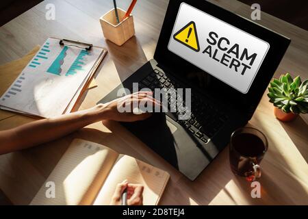 Scam alert detecting warning. Notification on device screen Stock Photo