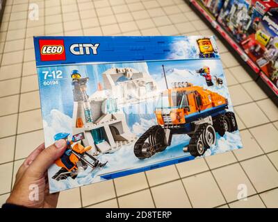 Puilboreau, France - October 14, 2020: Supermarket shelves filled with snowy figurine Lego display for sell in the supermarket shelves Stock Photo