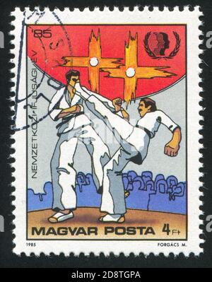 HUNGARY - CIRCA 1985: a stamp printed in the Hungary shows Fire Lily ...