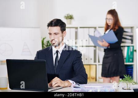 Entrepreneur working on laptop Stock Photo