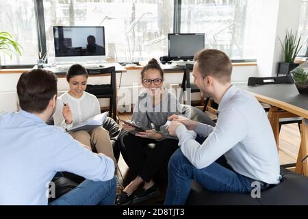 Happy young multiracial startup entrepreneurs taking part in training. Stock Photo