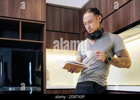 Man reading book in the morning Stock Photo
