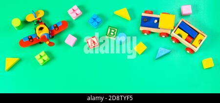 Set of colorful children toys on light green background. Top view, flat lay Stock Photo