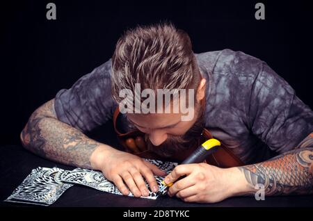 Handyman forms new leather product at the shop Stock Photo