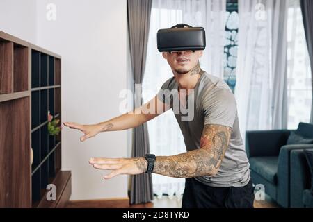 Excited man in VR glasses Stock Photo