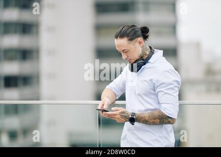 Serious man checking messages Stock Photo