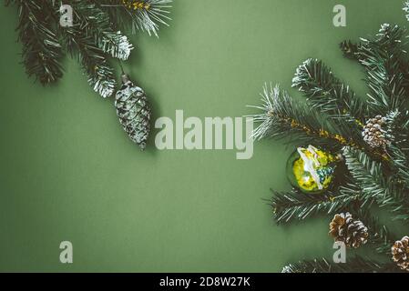 Little Santa stands next to an Armenian wooden Christmas tree toy