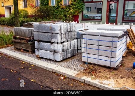 close-up of a construction road site with pile of stone plates Stock Photo