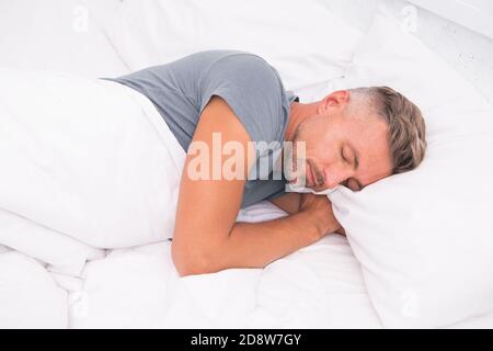 Relaxed Man Promote Prevention And Management Of Sleep Disorders World Sleep Day Benefits Of Good And Healthy Sleep Breathe Easily Sleep Well Handsome Man In Bed Sleeping Guy At Home Stock Photo