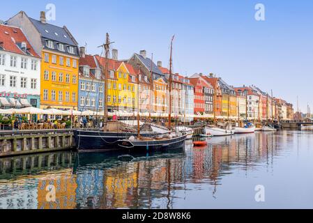 Nyhavn, Copenhagen, Denmark - Nyhavn is one of the most iconic places in Copenhagen and a perfect spot to hang out in the sun or go for Stock Photo