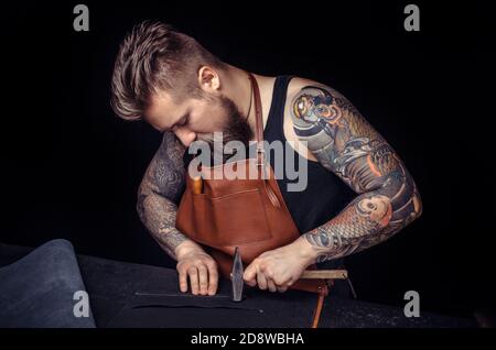 Skinner forms new leather product in the shop Stock Photo