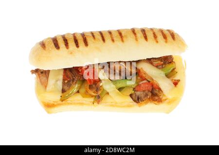 Beef, onion, pepper, tomato and emmental cheese in a panini  isolated against white Stock Photo