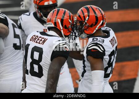 Cincinnati, OH, USA. 25th Oct, 2020. Tyler Boyd #83 of the Cincinnati  Bengals runs the ball after a catch as Ronnie Harrison #33 of the Cleveland  Browns attempts a tackle during NFL