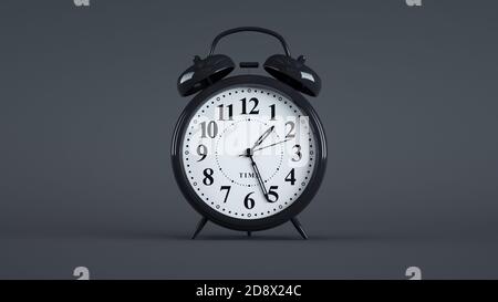 Close-up of an analog alarm clock on dark background. (Black) Stock Photo