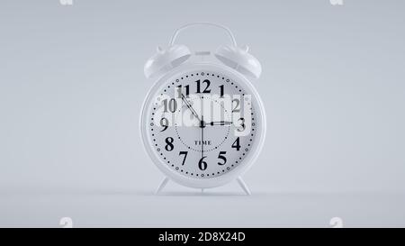 Close-up of an analog alarm clock on white background. (White) Stock Photo