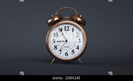 Close-up of an analog alarm clock on dark background. (Bronze) Stock Photo
