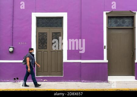 People walking in a mostly empty downtown Merida during the Covid19 Pandemic, November 2020 - Many shops being closed and many businesses went out of business because of the Coronavirus restrictions. Merida, Yucatan, Mexico Stock Photo