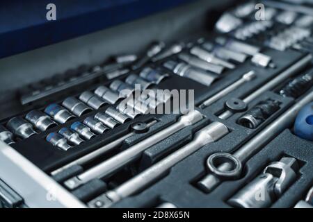 Set of tools and wrenches for car repair in garage service, close up. Stock Photo