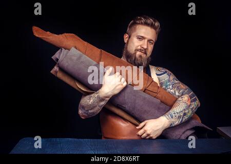 Currier working on a new leather product Stock Photo
