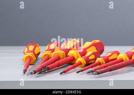 A set of a lot of different red tools for working include hammer screwdriver on gray background Stock Photo