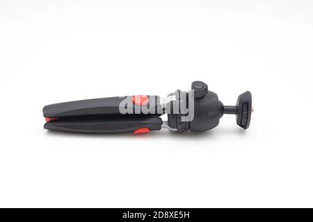 Folded Tripod isolated on white background Stock Photo
