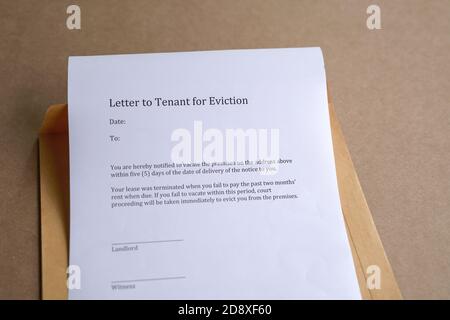 Letter to tenant for eviction, on top of brown envelope Stock Photo