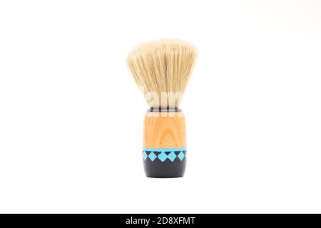 Brush for shaving beard with wooden handle isolated on white background Stock Photo