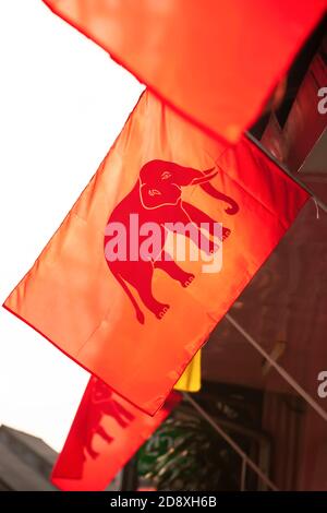 Elephant flag or Flag of Siam displaying in front of a house in a neighbourhood of Trat in March 23, Trat Memorial Day, on this day in 1906, Thailand. Stock Photo