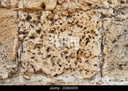 The texture of the stone with which the walls were lined Herod's Palace in the Caesarea Primorskaya National Park. Stock Photo