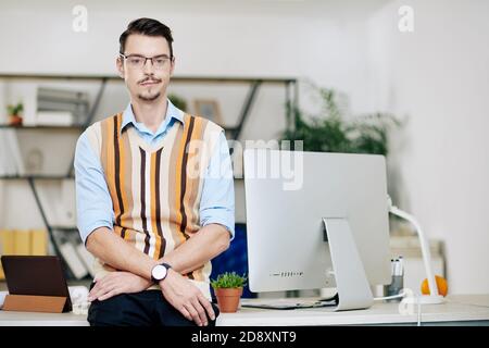 Smiling young computer engineer Stock Photo