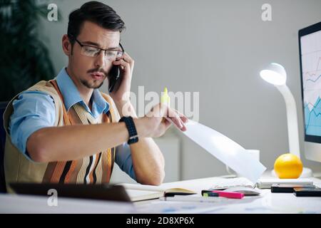 Surprised businessman checking time Stock Photo
